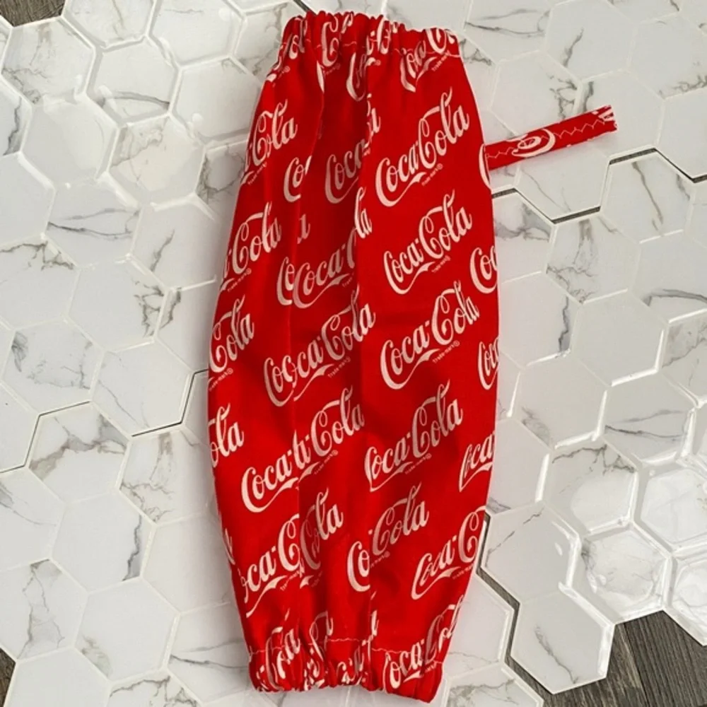 Handmade wall hanging grocery bags organizer and pantry with Coca Cola logo.